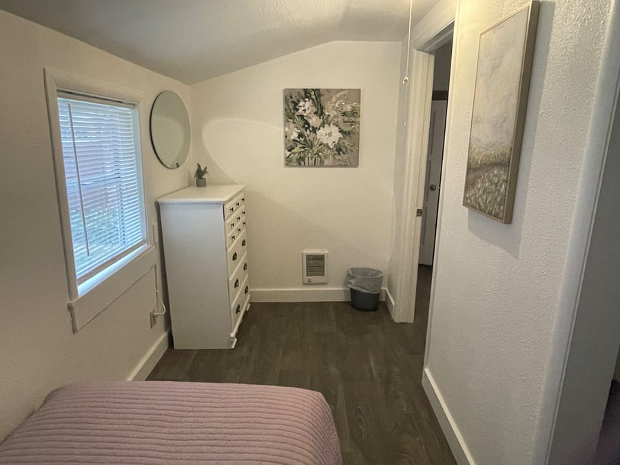 The table from the living room could be moved to this room in place of the dresser for a larger, more private work space. I may be willing to invest in a desk and chair. 
