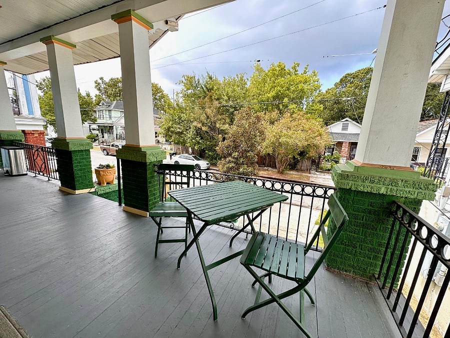 There is a lovely, deep porch with a table and chairs.