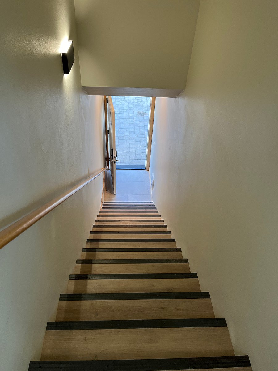Stairs down to front door