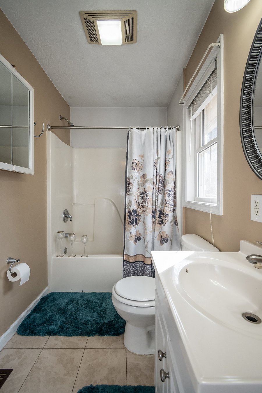 Full bathroom along with towels and W/D.