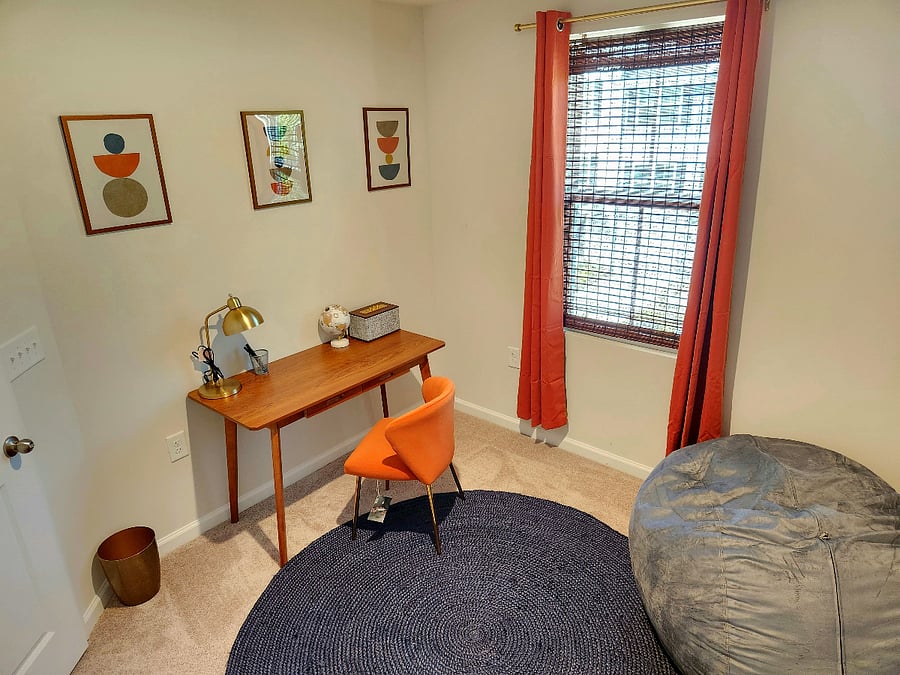 Dedicated office workspace that converts into a guest bedroom with beanbag that converts into a queen-sized bed. Pillows and sheets/covers for the bed are located in the closet. https://youtu.be/JxIUBDn84Ng