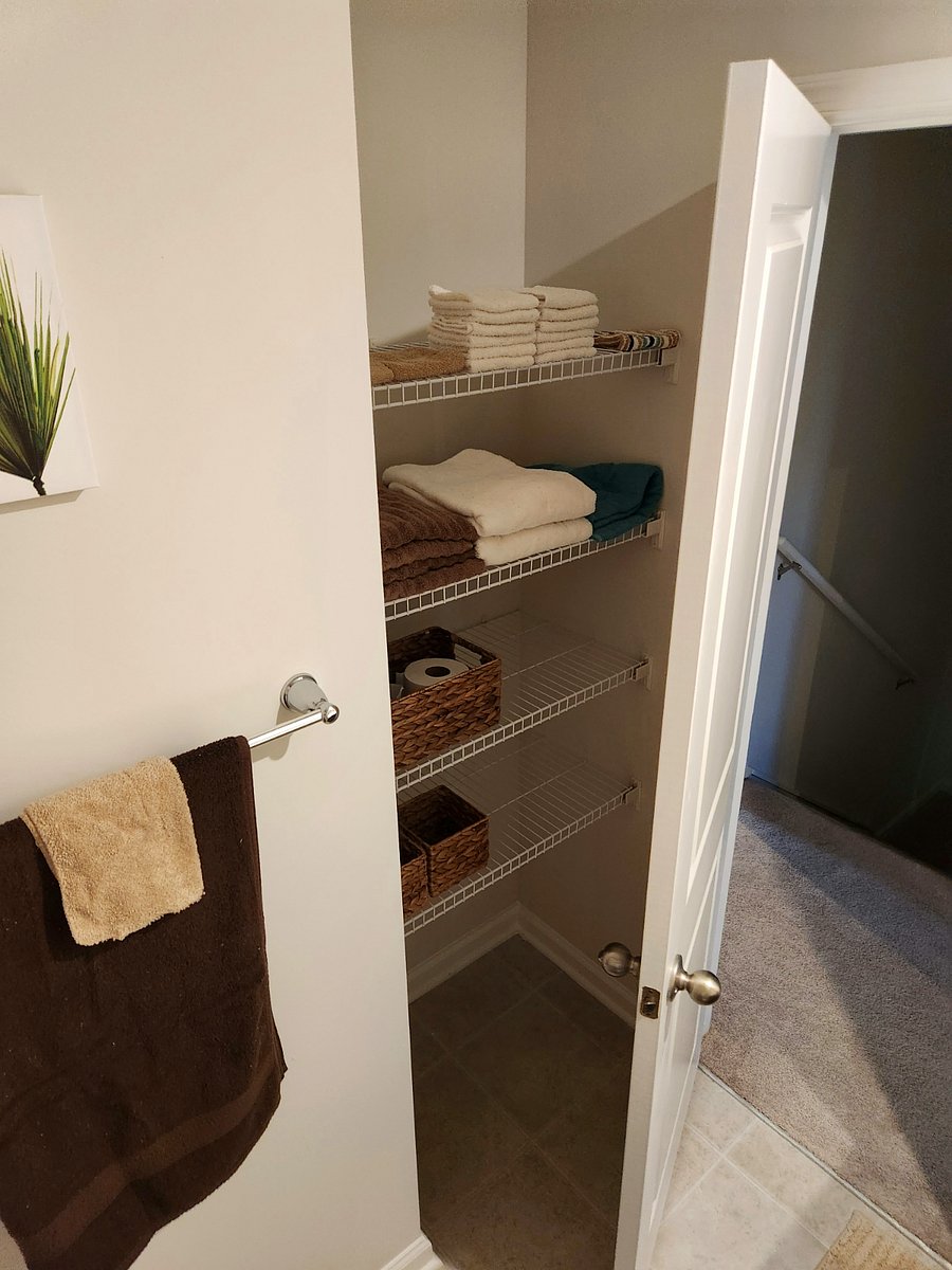 Extra washcloths, towels, and tissue in guest bathroom.