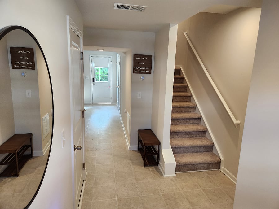 View from front entrance with shoe storage rack.