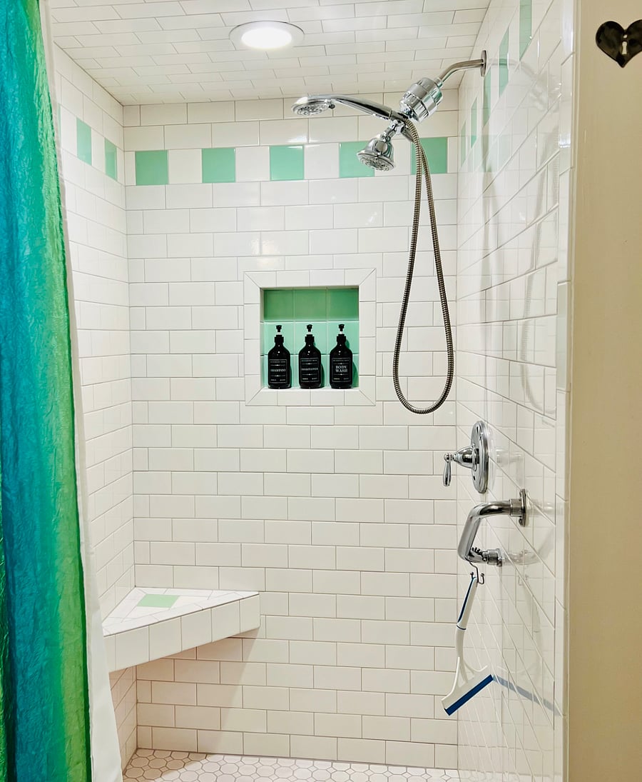 Roomy shower with vintage mint green tiles, 2 shower heads. Shampoo, conditioner, body wash and many other amenities. Please enjoy, but do not remove from the retreat.