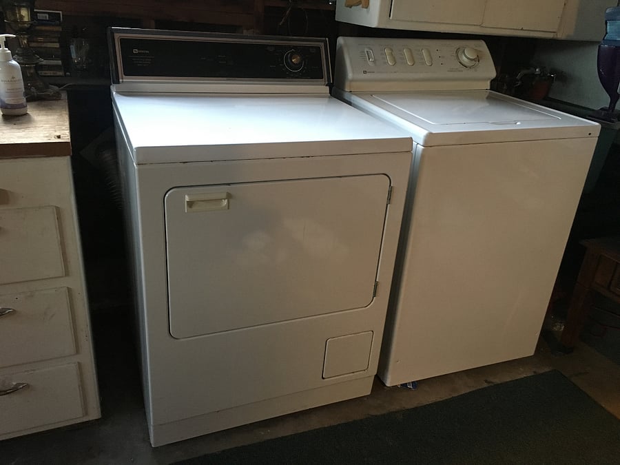 Washer and dryer are in the garage. They work well.  There is a cabinet above them for detergent and cleaners. 