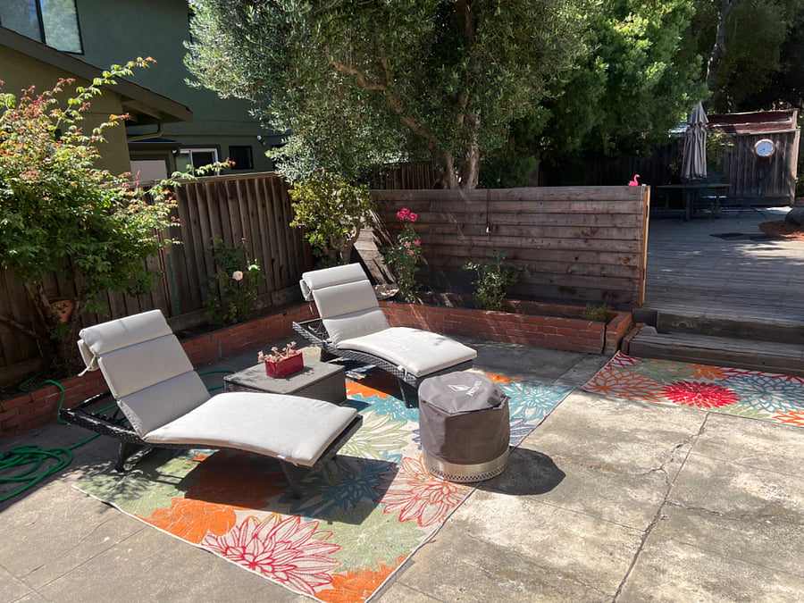 This is the 'rose garden'. A simple seating area with some rose trees.  (these loungers have been moved to the pool area and there are two other seats located here). Also have charcoal BBQ & a gas BBQ (not pictured)