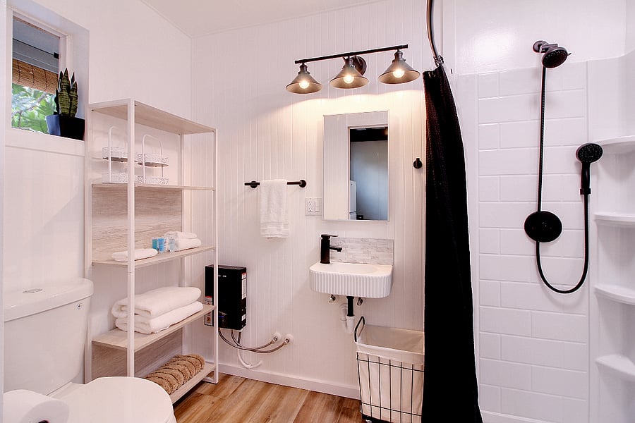 Full bathroom with tankless water heater.