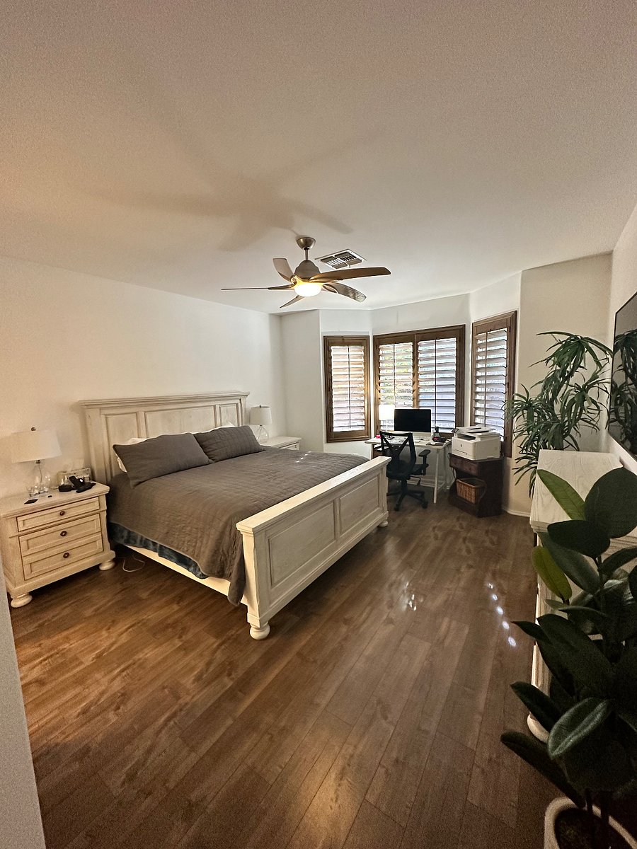 Large Primary Suite with modern pillow top mattress and computer and work area with laser jet printer.