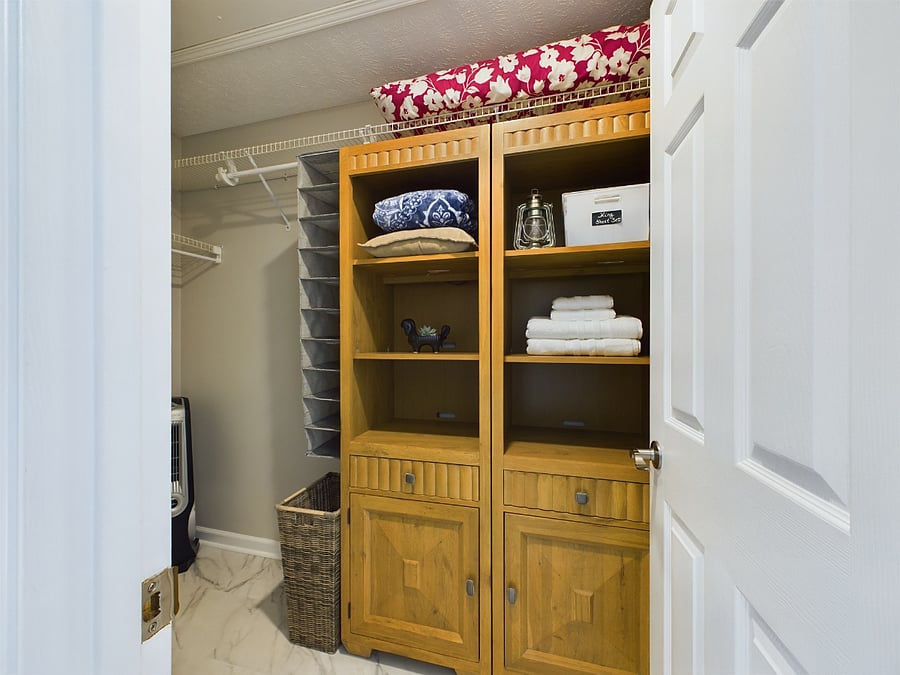 Spacious walk in closet off master bathroom