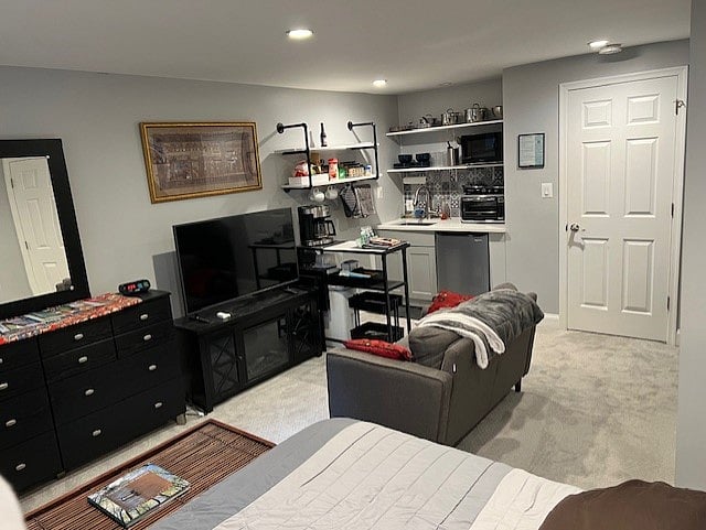 Guest only suite with smart tv, kitchennette, electric fireplace, work station, and closet.