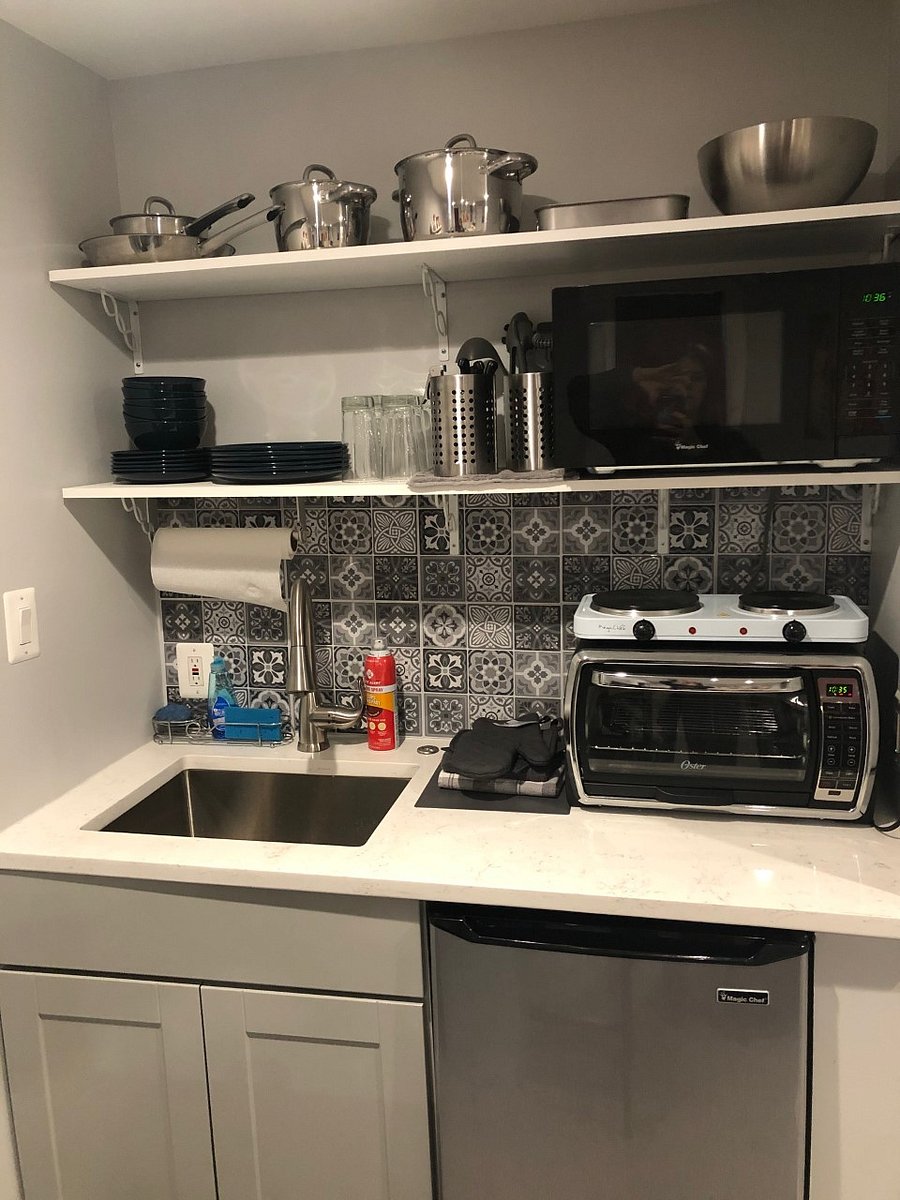 Fully stocked kitchennette with cuttlery and cooking pots/pans. Full size microwave, counter top oven, burners, 4.5 cubic fridge, full size sink with cleaning supplies, and shelves/storage. Coffee maker/tea kettle. Spice rack and sugar included.