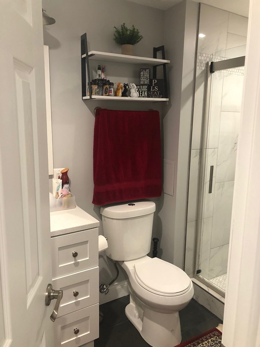 Toilet and full sized shower with laundry basket, extra pillows, sheets, and blankets. First aid kit and hair drier.