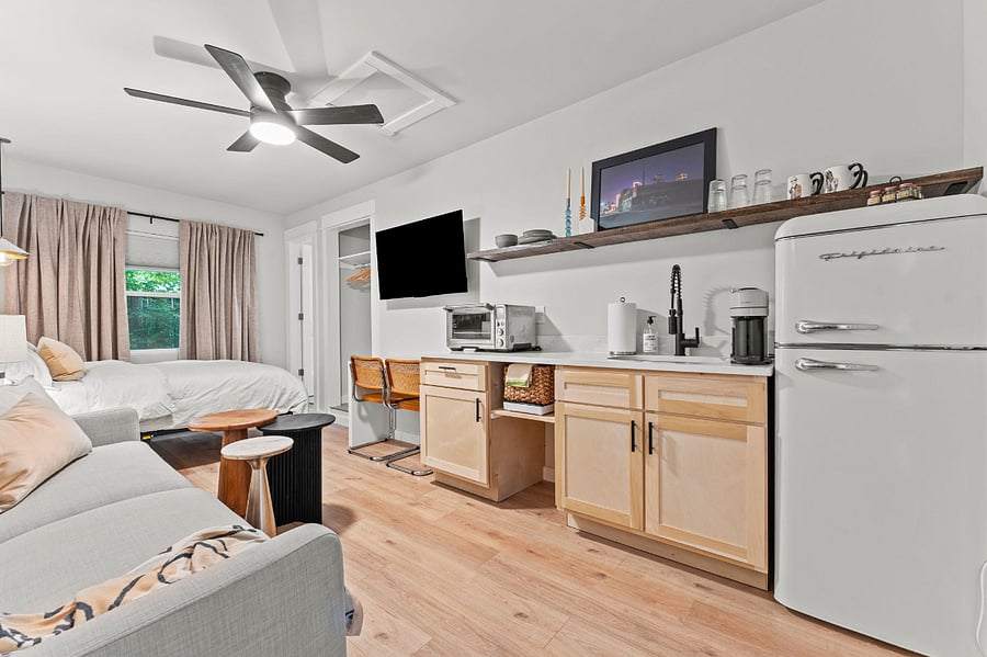 View of kitchen and table/work desk. 
