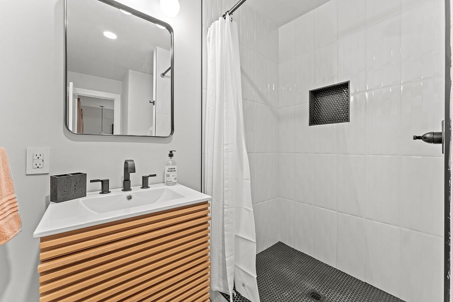 Floor to ceiling tile in shower. 