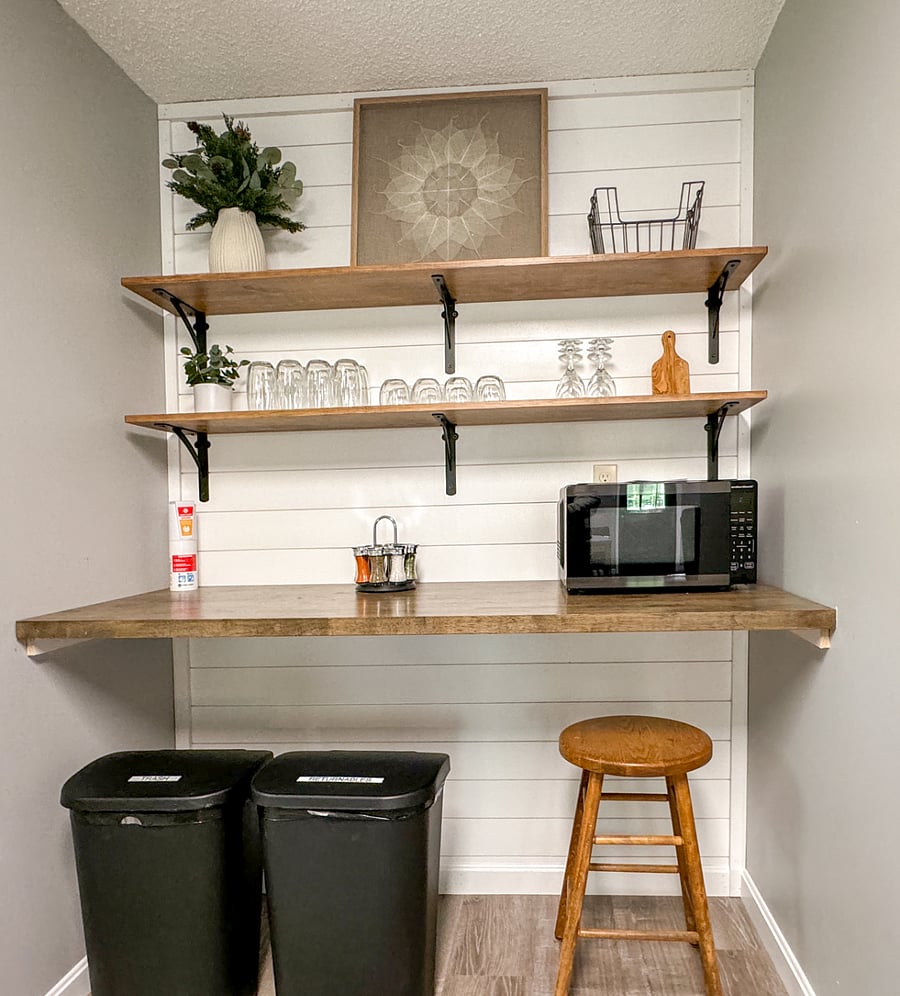 Plenty of counter space with glassware and microwave.
