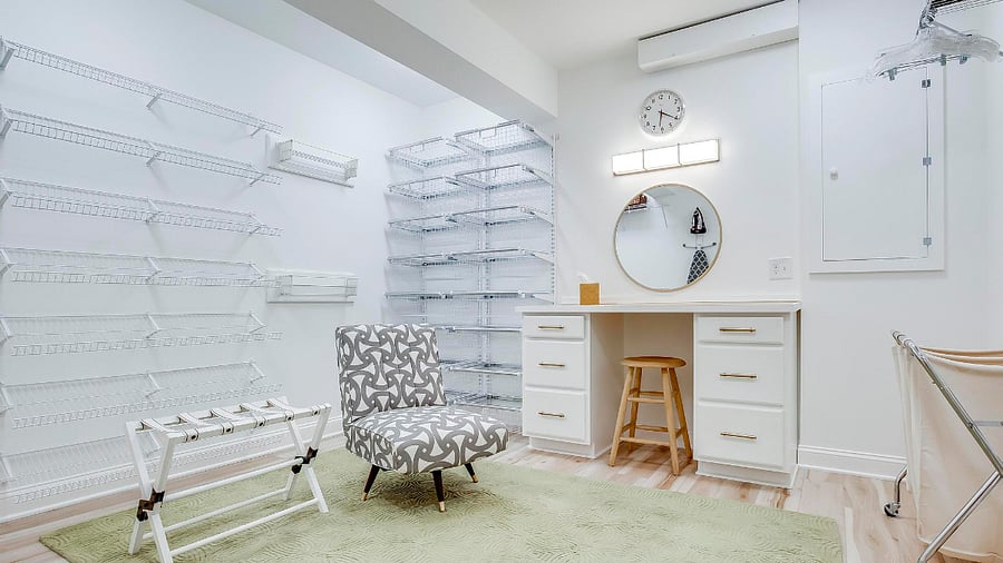 Hanging racks for laundry along with a sorter and luggage rack.