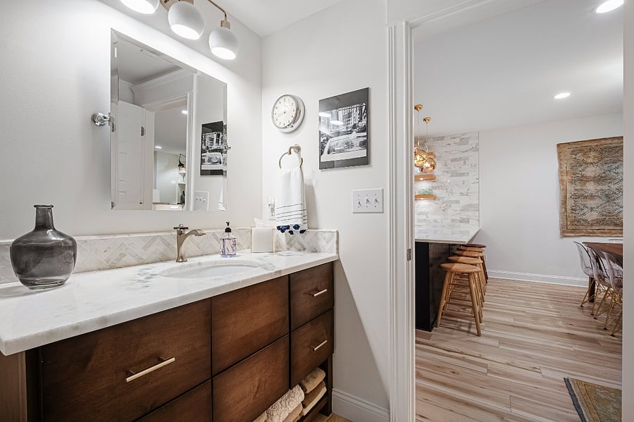 Luxury White Carrara Marble continues the glamorous theme into the bathroom. A beautifully appointed vanity with a retro knob and under counter sink and large drawers are so convenient. A Hair Dryer is also available.