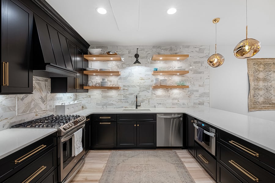 A large Kitchen with room to move and relax after a long day. Enjoy the custom cut Calacatta Gold Marble tiling for a perfect finish.
