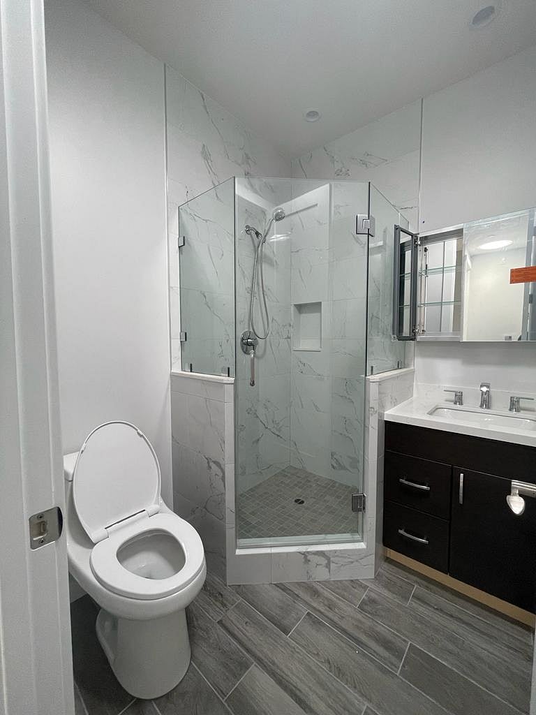 Private Bathroom with Large Standing Shower and Sink with Mirror and storage