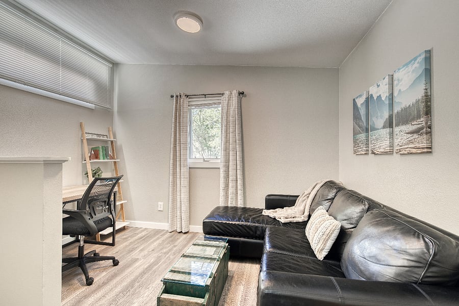 The couch in the upstairs loft offers for additional seating while also allowing separate spaces to relax for each guest, if needed.