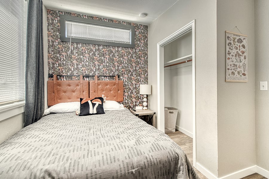 The fun mushroom wallpaper, mushroom poster, and mushroom nightlight make this room fit for a fungi!