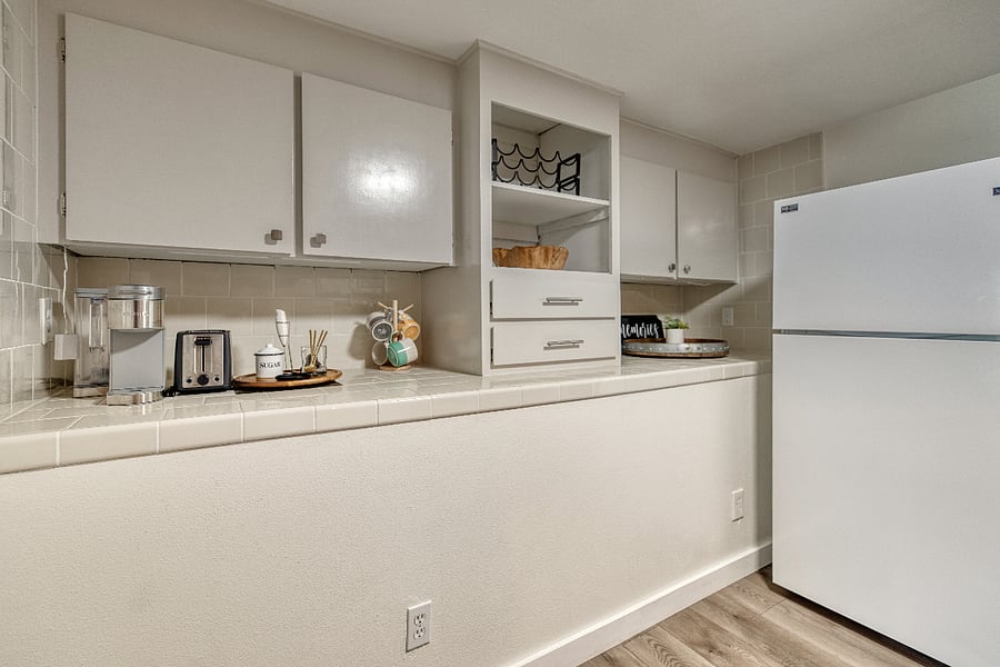 This kitchen has lots of space for food storage and has a Keurig to help you get going in the morning.