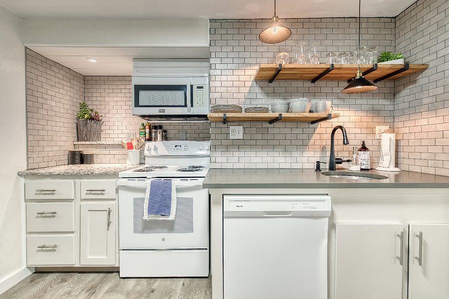 Cooking is easy in this kitchen with the stove, oven, and microwave all in close proximity. And cleanup is a breeze with the dishes stored right above the sink and dishwasher.