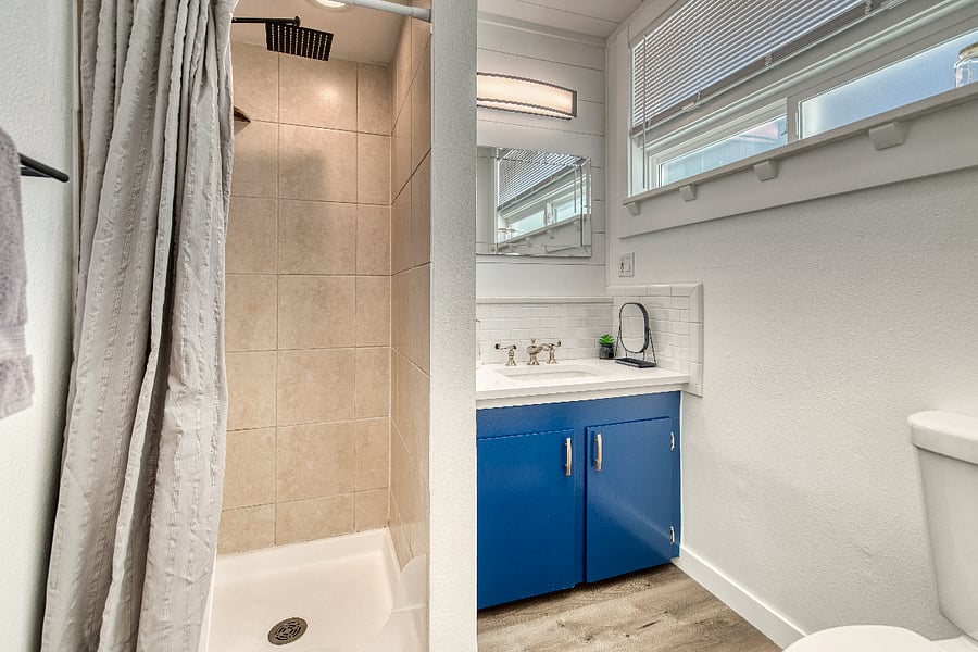 The bathroom has lots of great lighting and an extra ledge above the sink to keep all your amenities in order during your stay. The shower boasts a rain shower head and a removable wand attachment, to ensure you can wash off all of the dirt from your day out exploring Boise's many hiking trails.