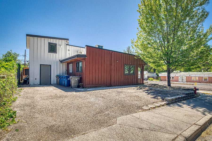 Two designated off-street parking areas available to all guests. Trash and Recycling bins for each unit are labeled and located at the rear of the building.