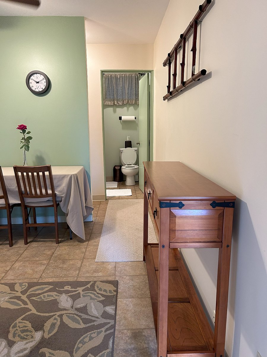View of entryway, dinning area, closet, and bathroom.