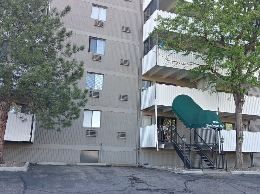 Front door with a couple off-street parking spaces (lots more available around the building)