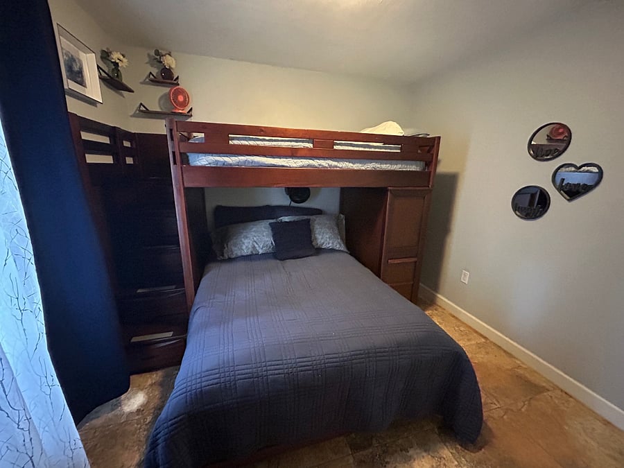 Double bunk beds, single bunk on top and full bottom. Perfect for kids room or a small family to bunk together! Games in closet, dollhouse + games in linen closet.