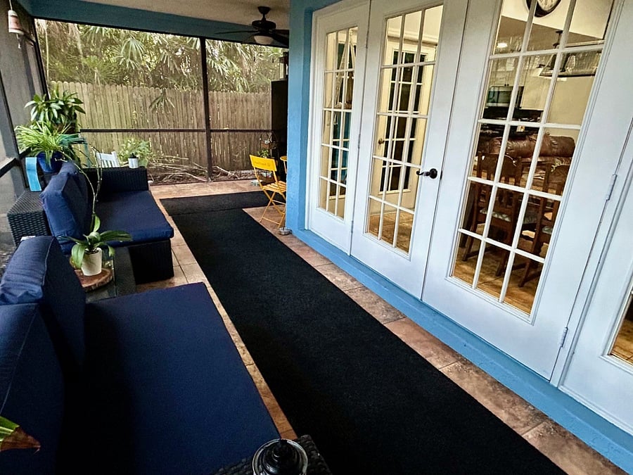 Screened in porch with ceiling fans and lighting