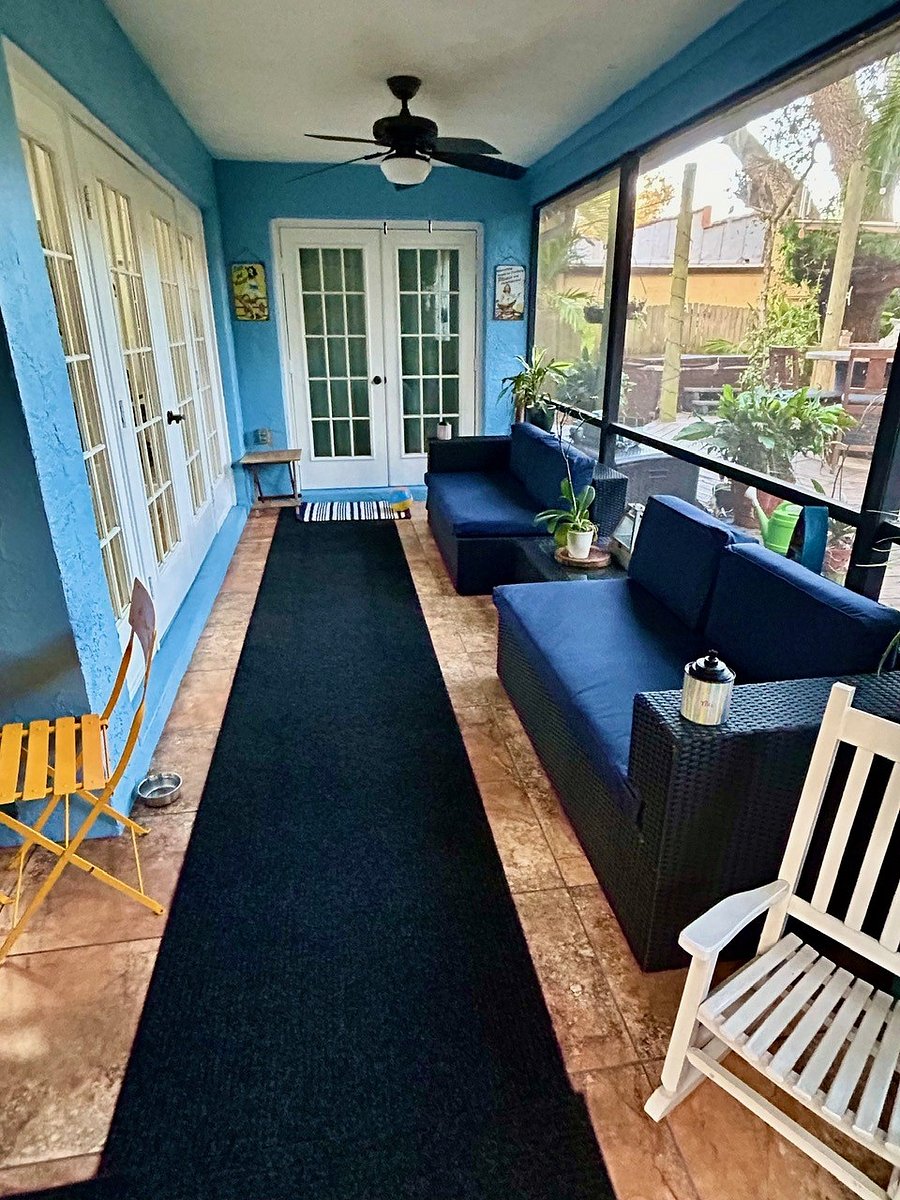 Screened in porch with ceiling fans and lighting