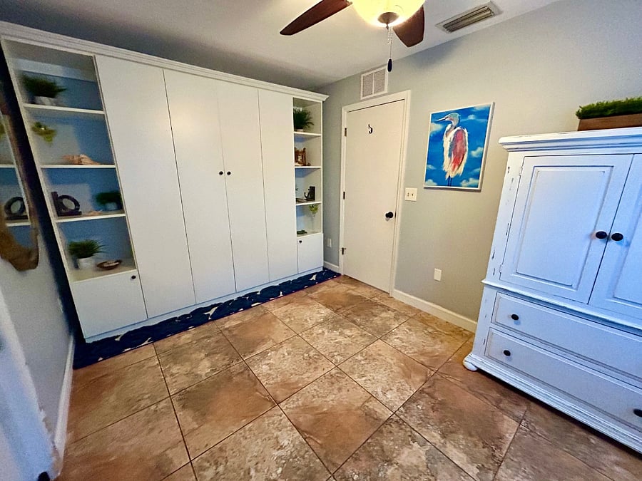 3rd bedroom functions as an office or bedroom with easy-to-open queen murphy bed.
