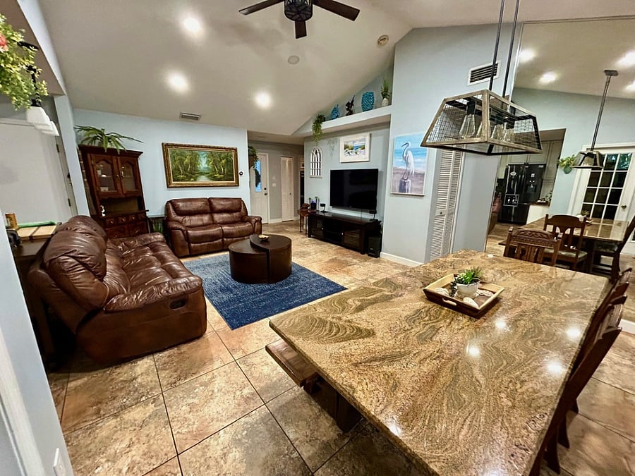 Living room space with 3 seat sofa and love seat, 4 reclining seats total.