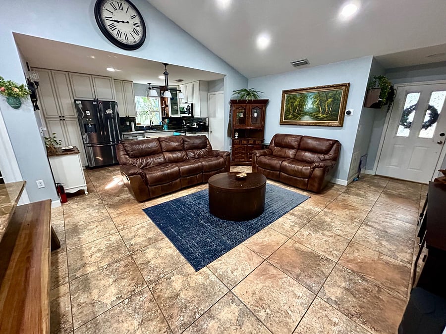 Living room space with 3 seat sofa and love seat, 4 reclining seats total.