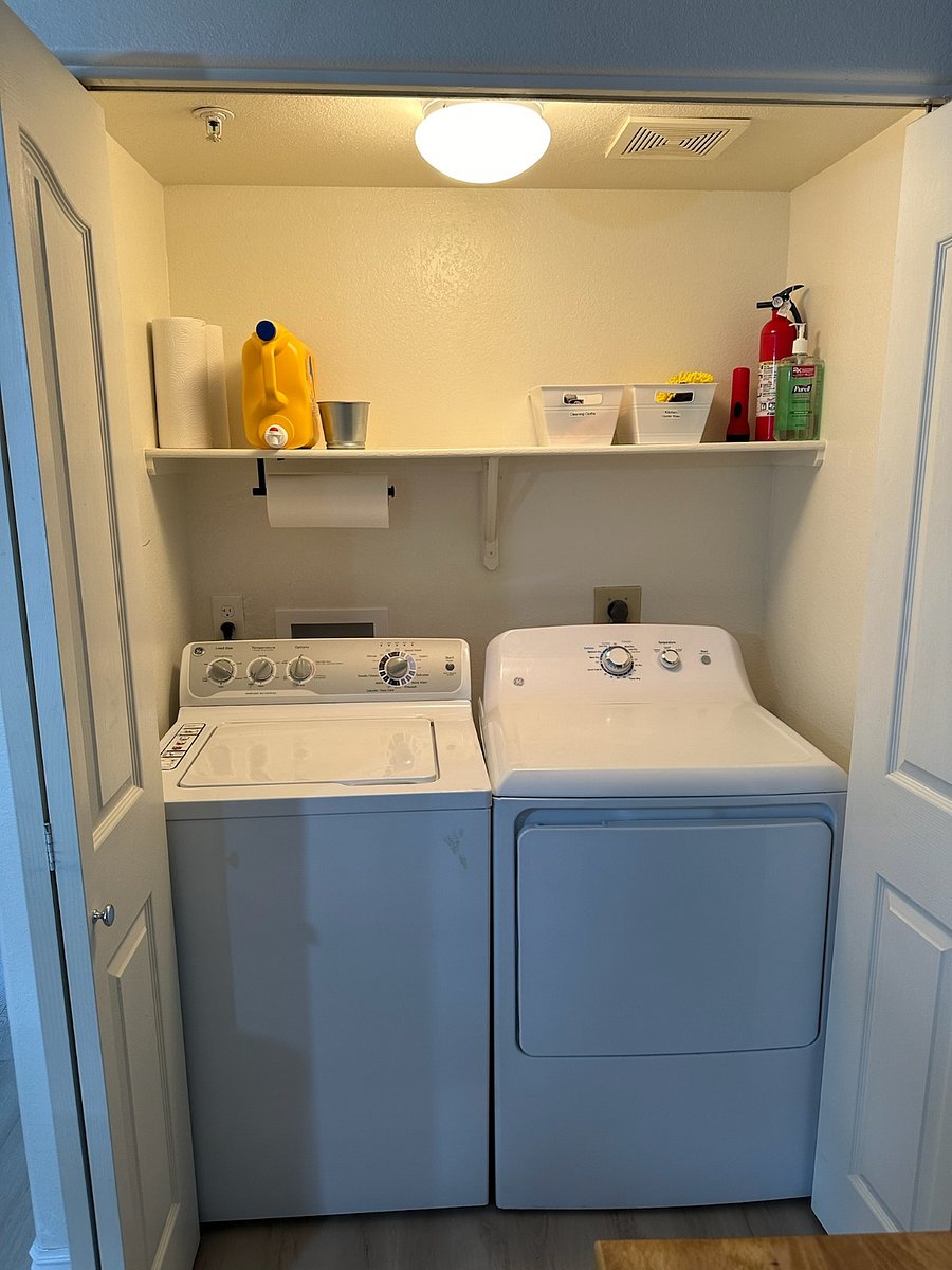 In-unit, full-size washer/dryer behind bifold doors