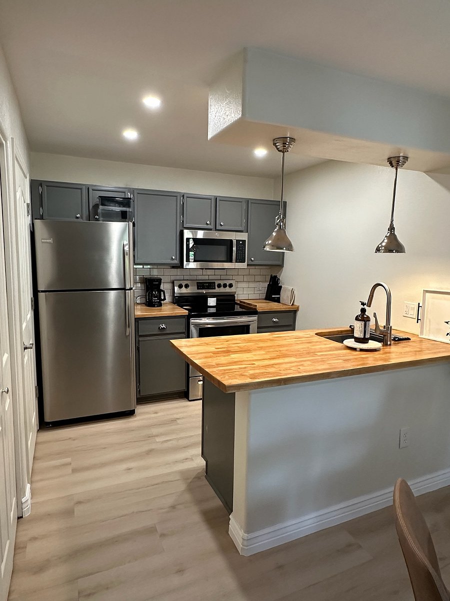 Fully-stocked kitchen, walk-in pantry to the left of fridge