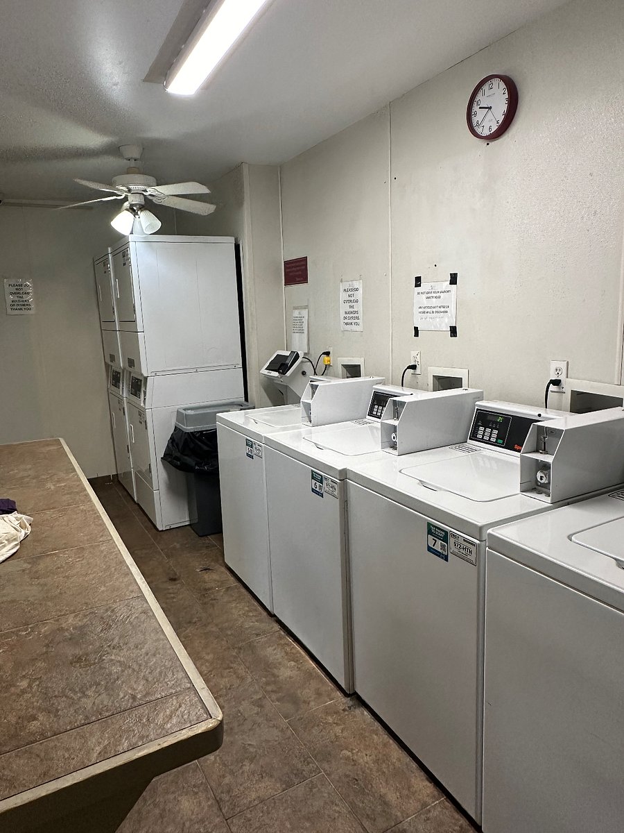 Laundry room can be reached under covered walkway very close to condo