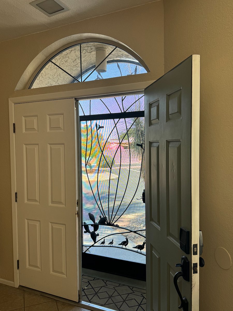 Custom screen door adds security, ventilation, and views.