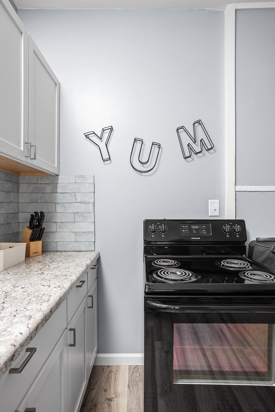 Modern kitchen with a playful touch'YUM' says it all!