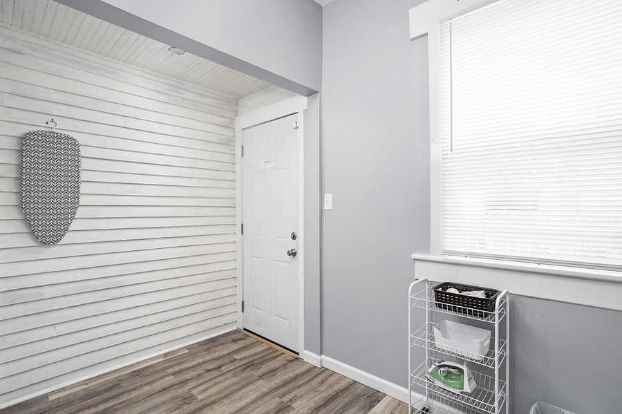 Bright and airy laundry/mudroom with a clean, modern touch.