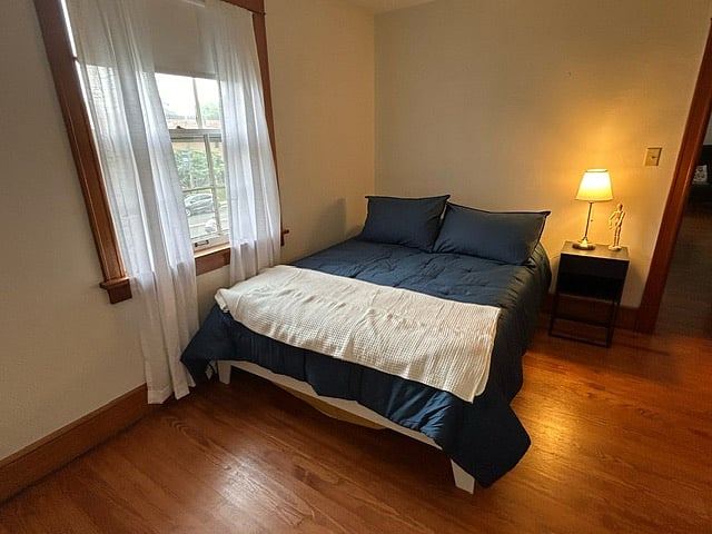 Unit 2 is divided into three rooms, bedroom, bathroom, and study. The bedroom is spacious and contains a queen size bed, night stand, lamp, two oversized windows, and a large closet. The "study" contains a cozy work desk and chair, loveseat, antique marble-top coffee table, two lamps, a closet with full-length mirror, and a beautiful floor rug.
In addition, Unit 2 comes complete with two sets of bed sheets, two comforters, ample towels, hand towels, face towels, and two bath mats.