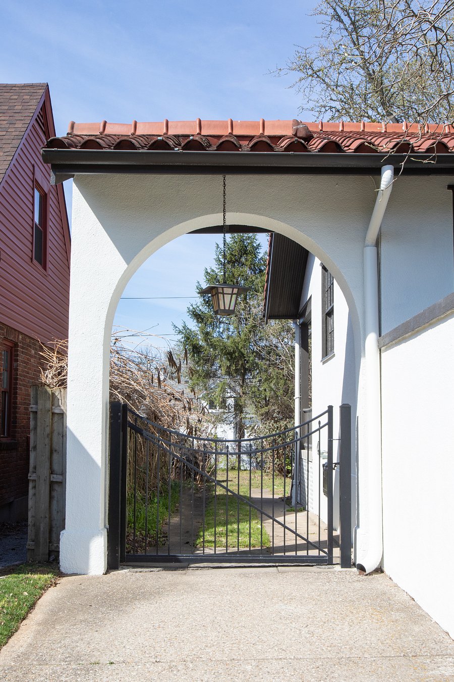 Porte cochere gate at driveway.