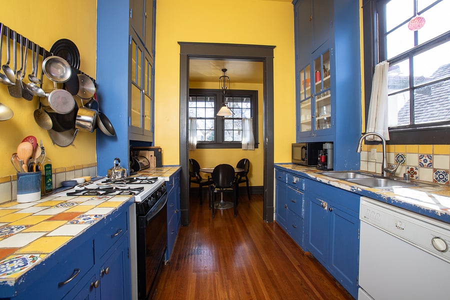 Bright kitchen with Mexican tile counters and backsplash.