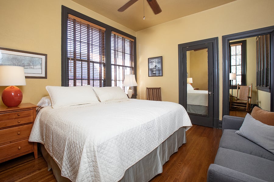 Primary bedroom with King bed and adjacent sittig room.