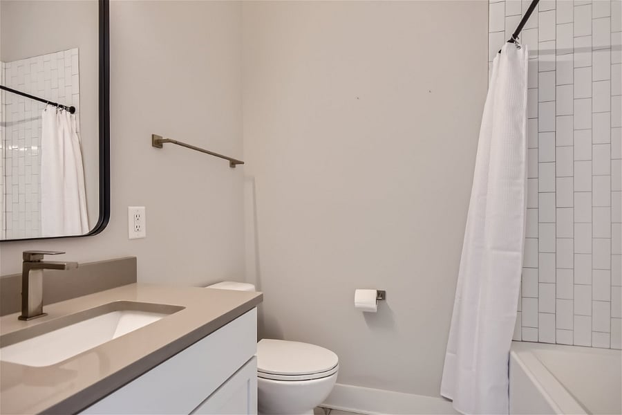 This full bathroom is located just inside the bedroom.