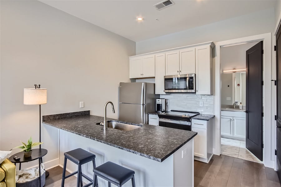 Fully stocked kitchen with modern finishes awaits!