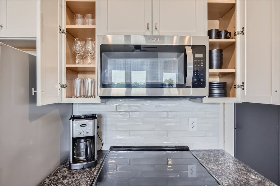 Included are place settings and utensils for 8, as well as a small collection of pot, pans, and cooking utensils.